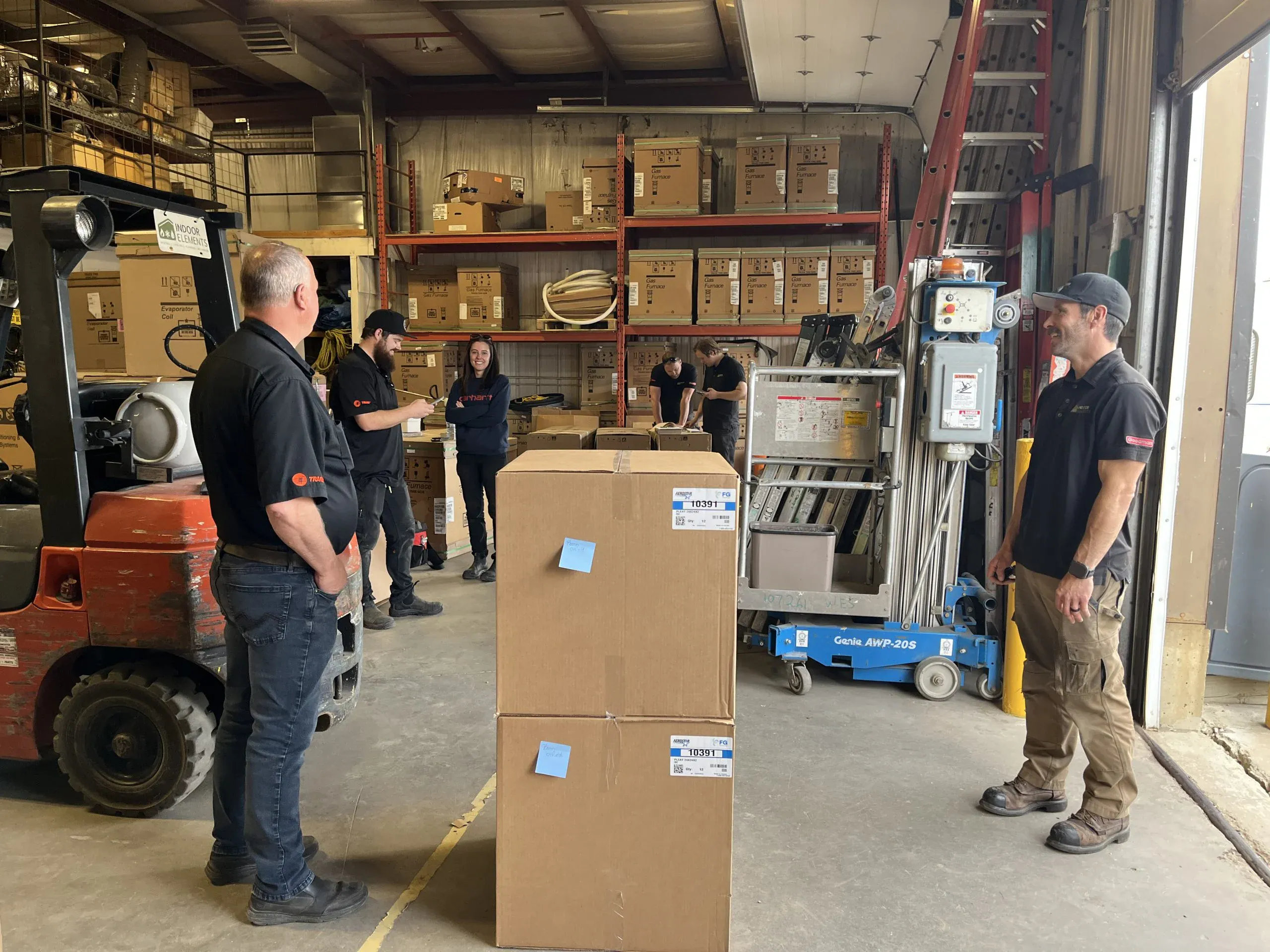 Technician inspecting an HVAC unit during a service call