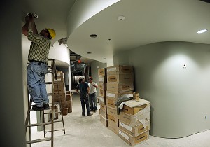 A worker installs lighting fixtures in a hallway of the new Penobscot Community Health Care facility at the former Wilson Square Mall on outer Wilson Street in Brewer on Thursday, June 3, 2010. BANGOR DAILY NEWS PHOTO BY KEVIN BENNETT